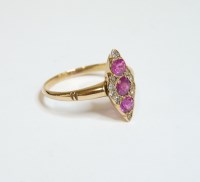 Lot 20 - A ruby and diamond marquise shaped cluster ring