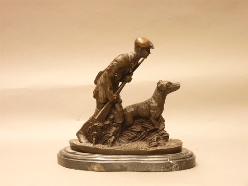 Lot 274 - A reproduction bronze of a hunter with his gun