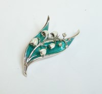 Lot 68 - A sterling silver and enamel lily of the valley brooch