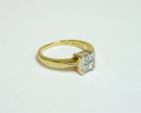 Lot 4 - An 18ct gold four stone princess cut diamond square cluster ring