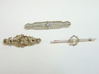 Lot 49 - A cased seed pearl and diamond gold bar brooch