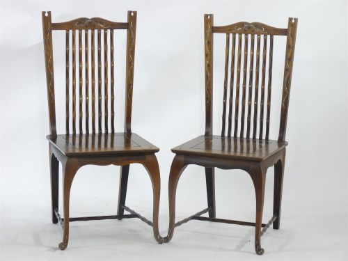Lot 614 - An unusual pair of Arts and Crafts single chairs