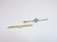 Lot 28 - A sapphire and diamond bar brooch