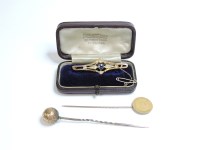 Lot 111 - A sapphire and seed pearl gold bar brooch