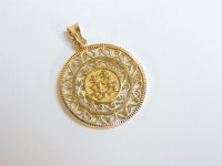 Lot 10 - An Asian gold double xi pendant