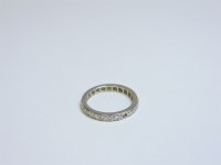 Lot 13 - A diamond set full eternity ring