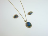 Lot 65 - A gold black opal doublet pendant and earring suite