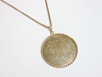 Lot 18 - A gold monogram pendant