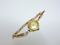 Lot 44 - An 18ct gold ladies mechanical bracelet watch