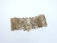 Lot 98 - A 9ct gold ten row gate bracelet