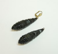 Lot 40 - A pair of carved jet pippin drop earrings