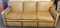 Lot 609A - A brown leather three seater settee