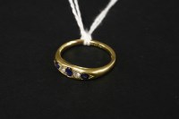 Lot 64 - An 18ct gold Edwardian sapphire and diamond ring