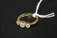 Lot 78 - An 18ct gold diamond set triple cluster ring
