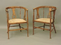 Lot 671 - A pair of Edwardian wheelback armchairs