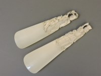 Lot 116 - A pair of late 19th century Chinese carved ivory shoe horns