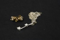 Lot 73 - A pair of gold single stone diamond stud earrings