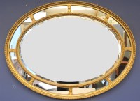 Lot 694 - A 19th century oval segmented gilt framed mirror