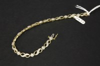 Lot 22 - A 9ct gold diamond cluster line bracelet