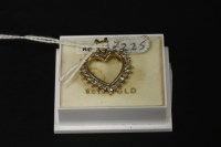 Lot 27 - A 9ct yellow gold diamond set heart pendant