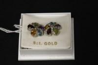 Lot 29 - A pair of 9ct white gold diamond and multi gemstone cluster earrings