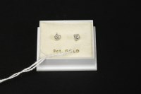 Lot 35 - A pair of 9ct white gold single stone diamond stud earrings