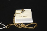 Lot 39 - A 9ct yellow and white gold diamond set rub over pendant