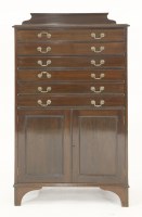 Lot 593 - A mahogany planner's chest on cupboard