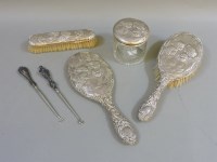 Lot 130 - A silver backed matched dressing table set