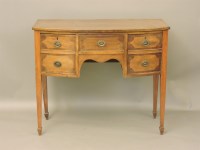 Lot 645 - A Sheraton style strung and crossbanded mahogany bow front sideboard