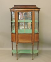 Lot 657 - An Edwardian strung mahogany D shaped display cabinet