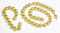 Lot 455 - A Chinese gold bead necklace and bracelet suite