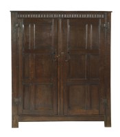 Lot 732 - An 18th century and later oak wardrobe