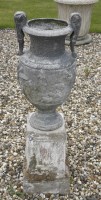 Lot 1670 - (WH) A pair of two handled lead urns