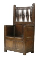 Lot 402 - An oak settle