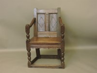 Lot 678 - An antique oak wainscot chair