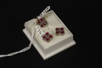 Lot 23 - A 9ct gold diamond and ruby pendant and earring suite