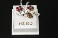 Lot 41 - A 9ct gold diamond and ruby pendant and earring suite