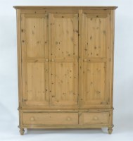 Lot 591 - A modern pine wardrobe