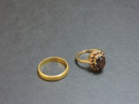 Lot 38 - A 9ct gold oval garnet cluster ring