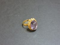 Lot 40 - A Continental synthetic colour change sapphire gold ring