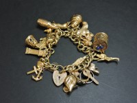 Lot 46 - A 9ct gold charm bracelet