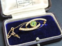 Lot 45 - An Edwardian gold and split pearl brooch
