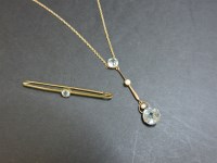 Lot 54 - An Edwardian two stone aquamarine Edna May gold pendant and brooch