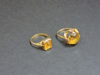 Lot 18 - Two 9ct gold single stone citrine rings