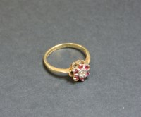 Lot 30 - A 9ct gold diamond and ruby cluster ring