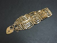 Lot 79 - A 9ct gold seven row gate bracelet