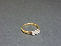 Lot 1 - A 9ct yellow and white gold three stone diamond ring