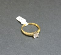 Lot 12 - An 18ct gold four stone princess cut diamond square cluster ring