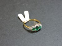 Lot 34 - An 18ct gold synthetic emerald and diamond regal cluster ring